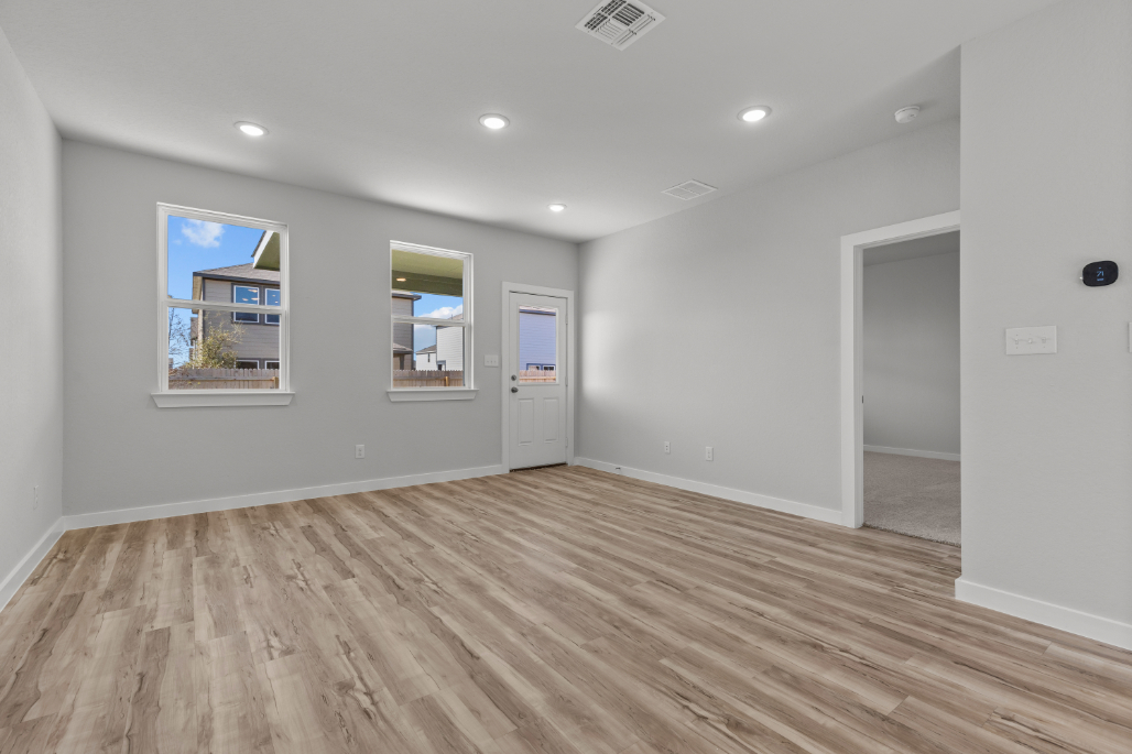 A room with a wood floor and a wood floor.