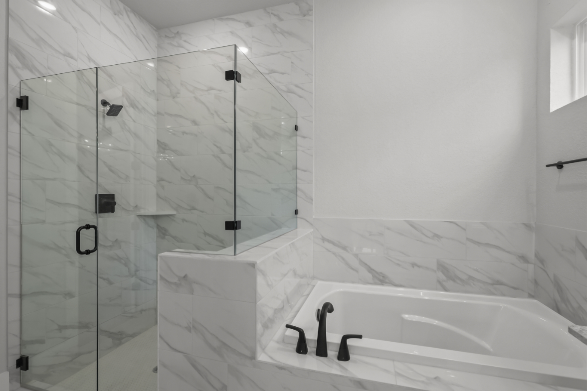 A bathtub and shower in a bathroom.