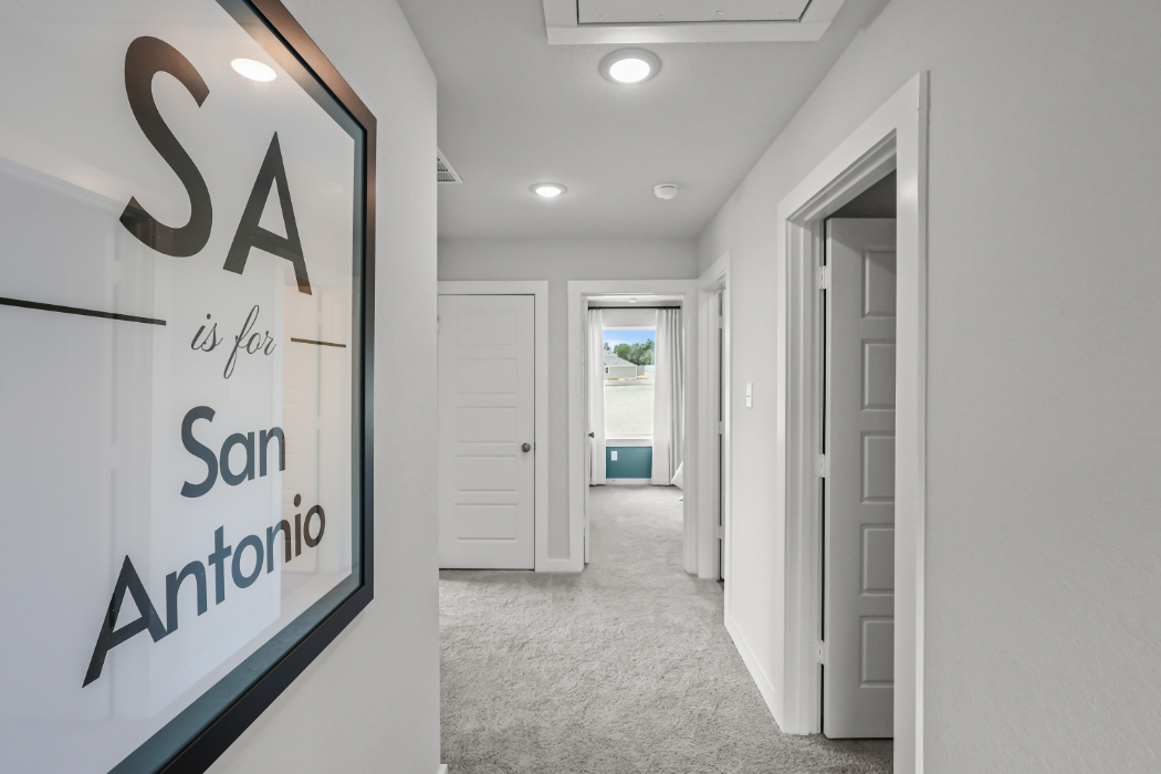 A hallway with white doors.