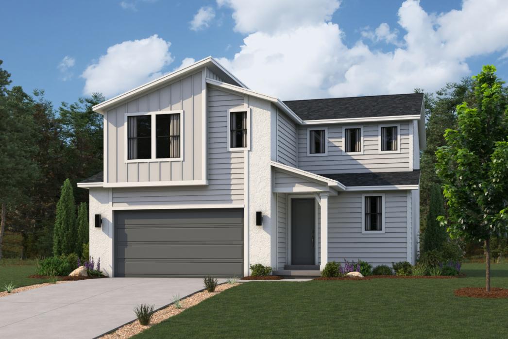 A white house with a green lawn.