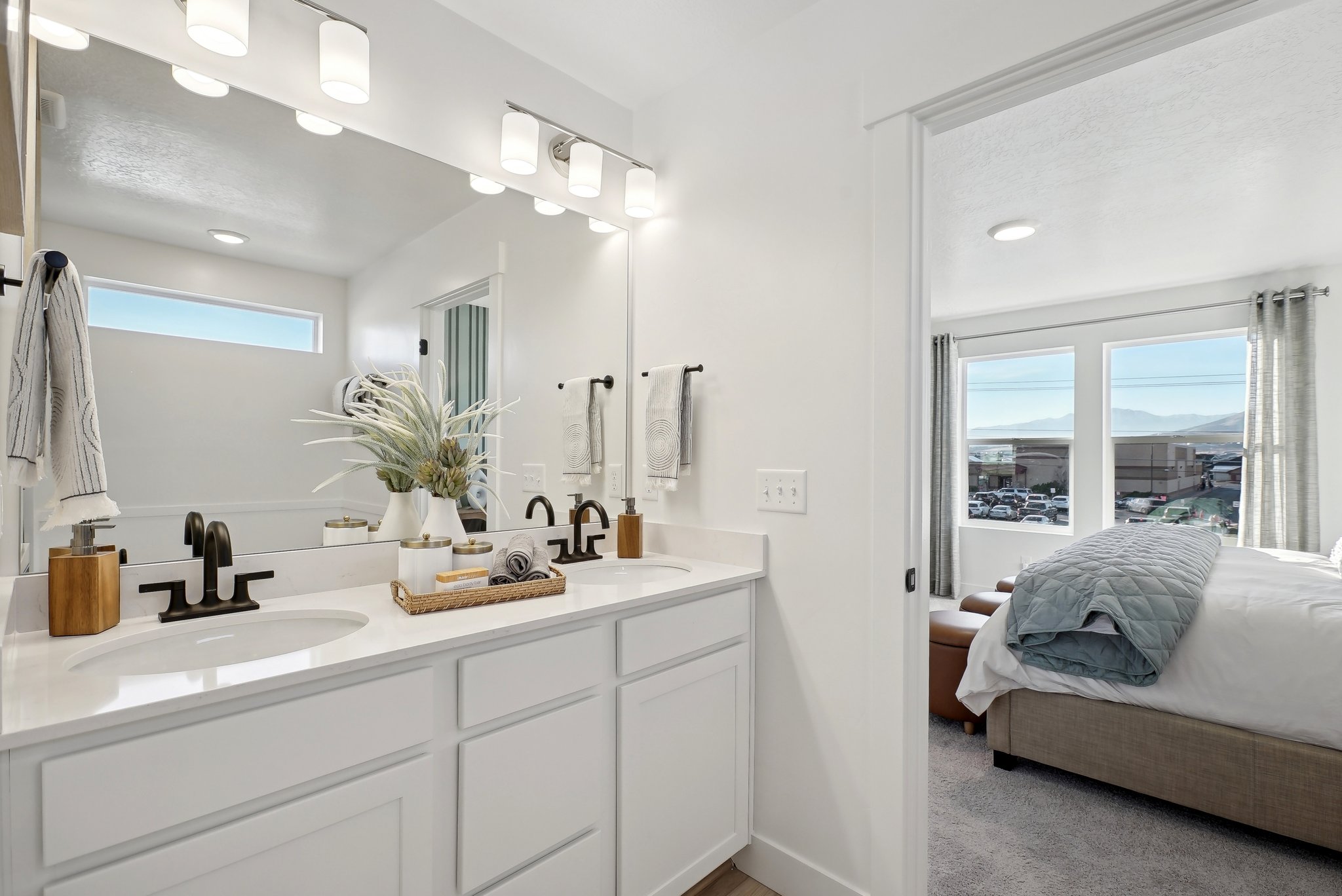 A bathroom with a large mirror.