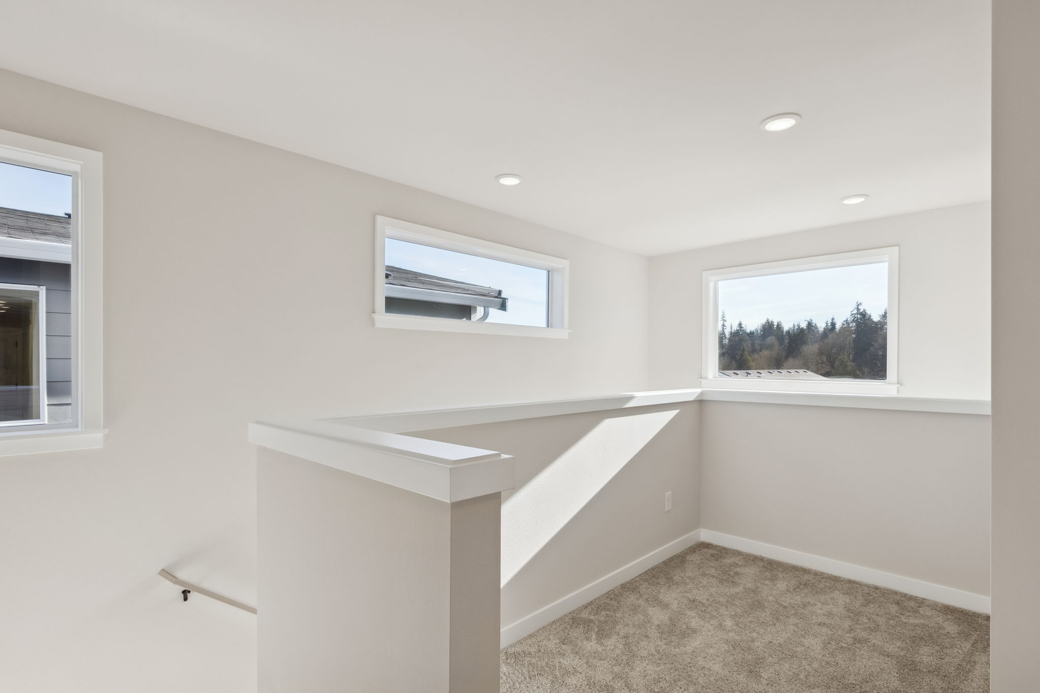 A room with a window and a shelf with a window.