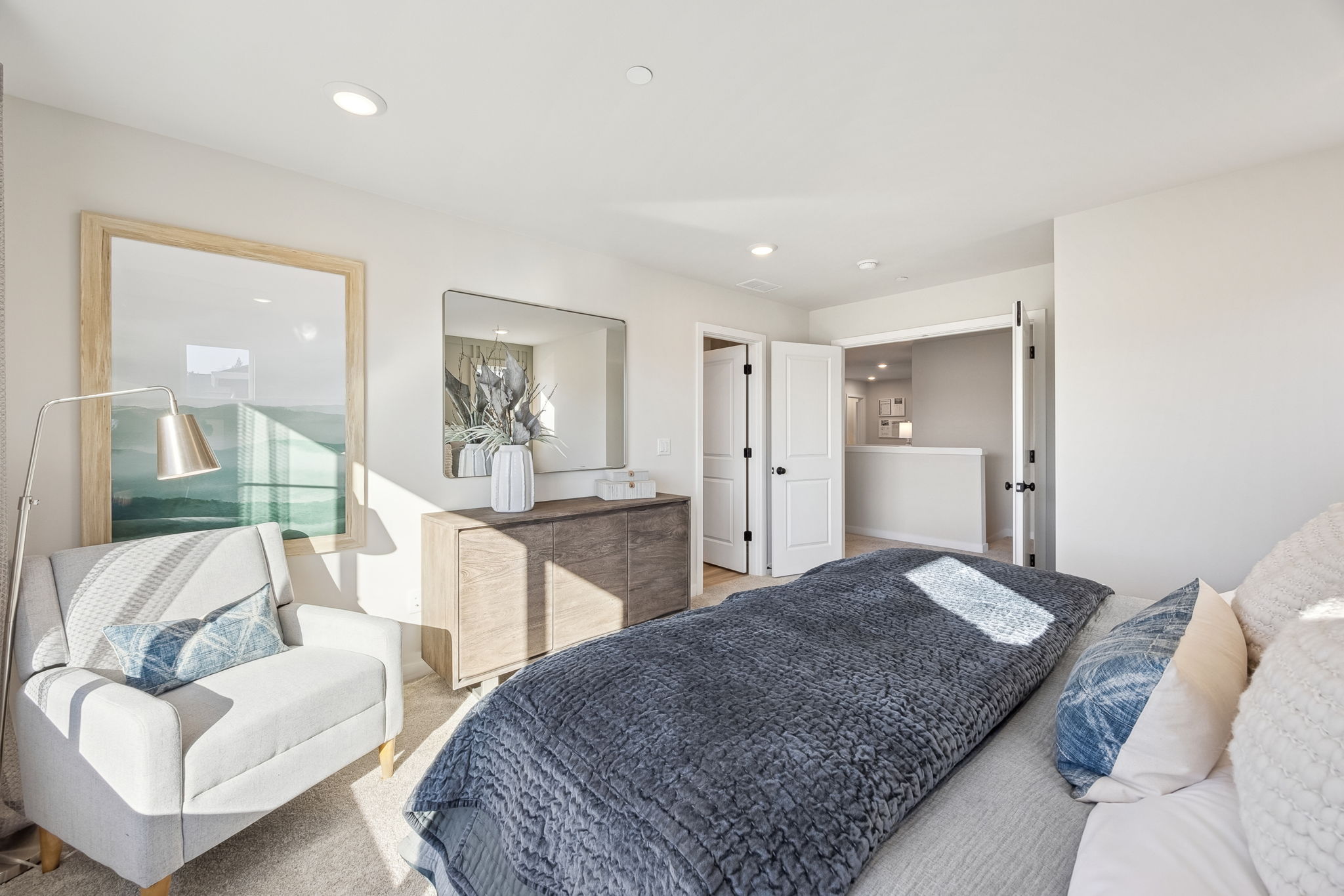 A bedroom with a bed and a couch.