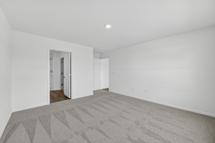 A hallway with white walls.