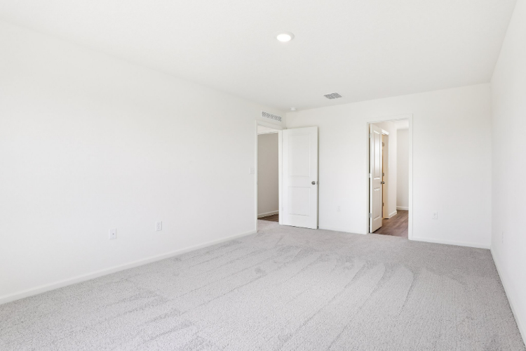A hallway with white walls.