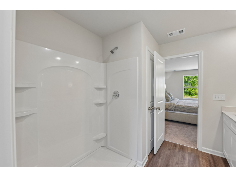 A room with a bed and a closet.