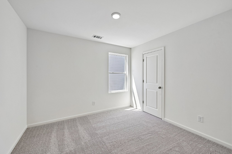 A room with a door and a window.