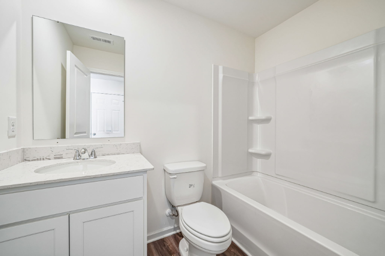 A bathroom with a toilet and sink.