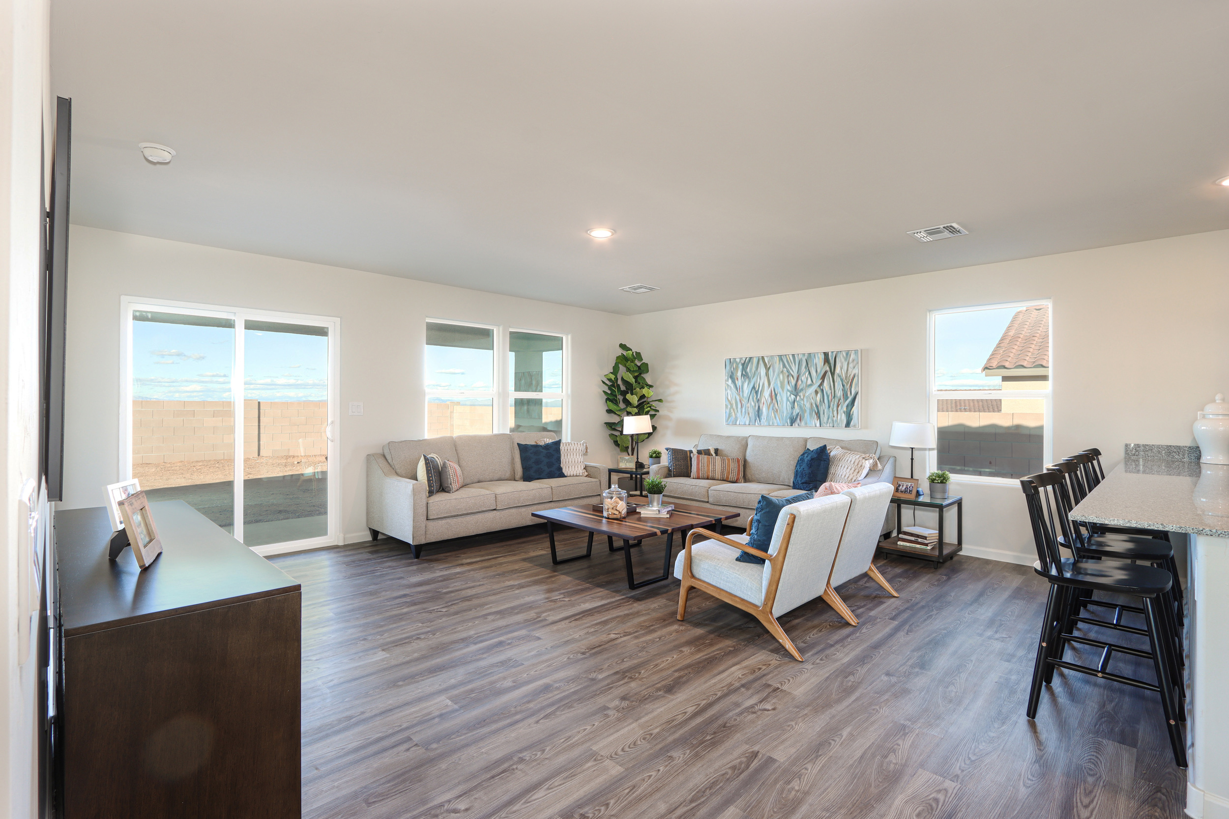 A living room with a wood floor.