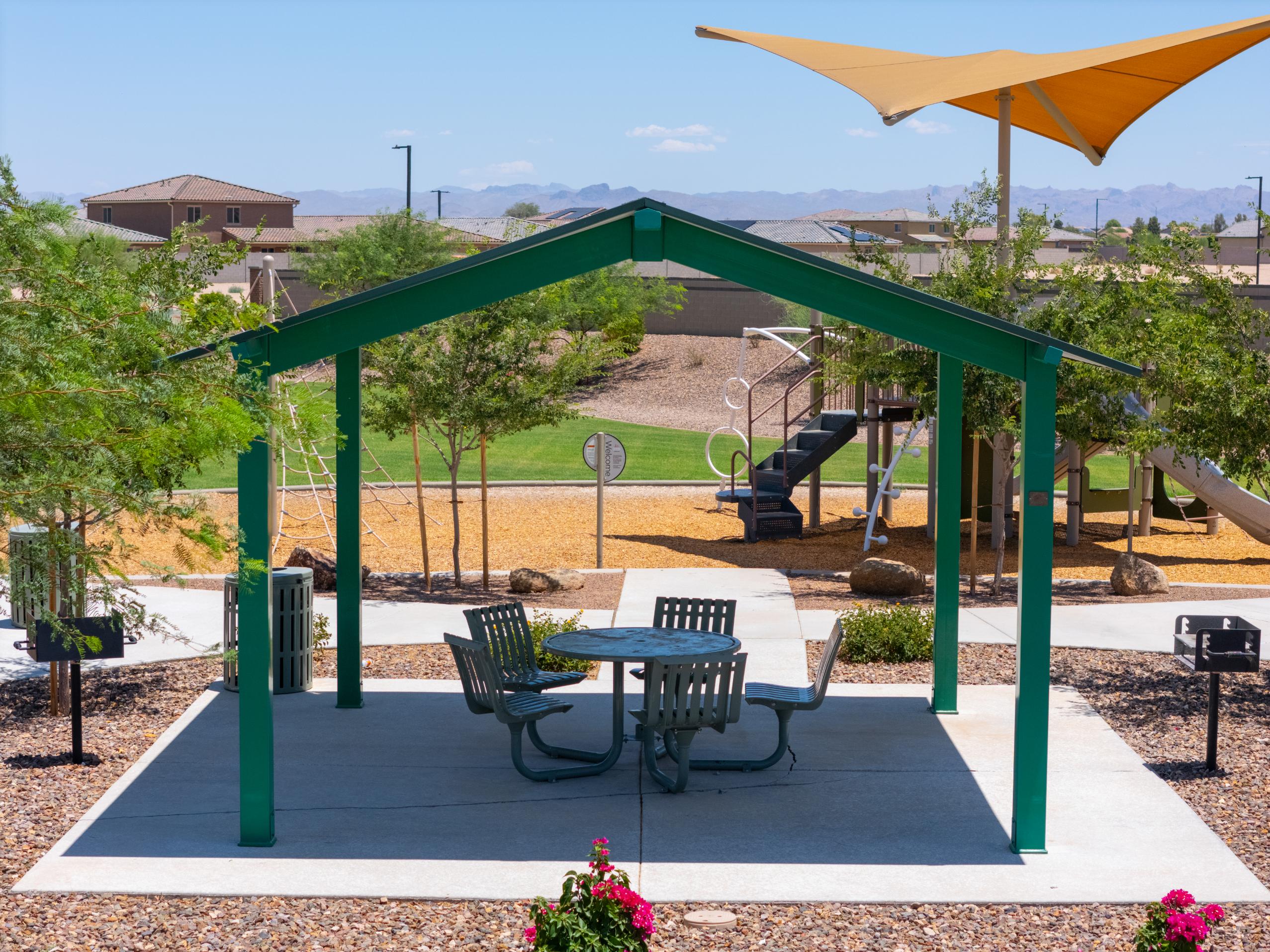 A patio with a table and chairs.