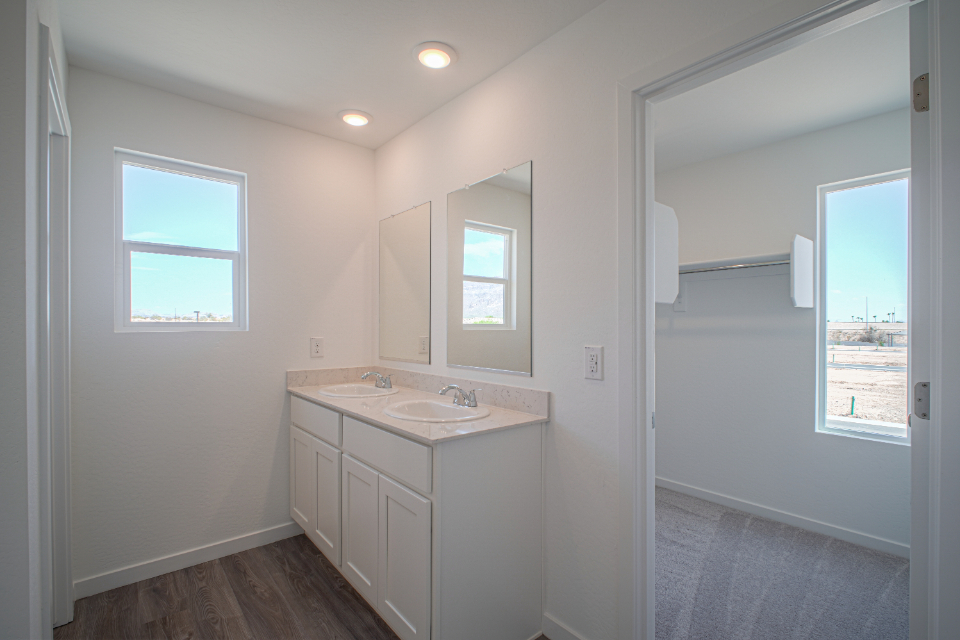 A bathroom with a sink and a mirror.