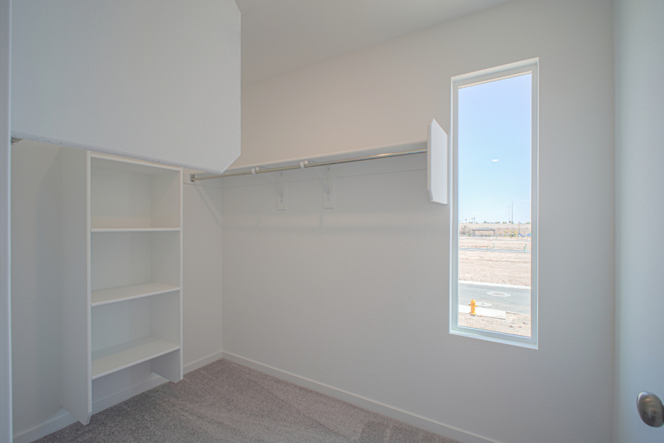 A white room with a window.