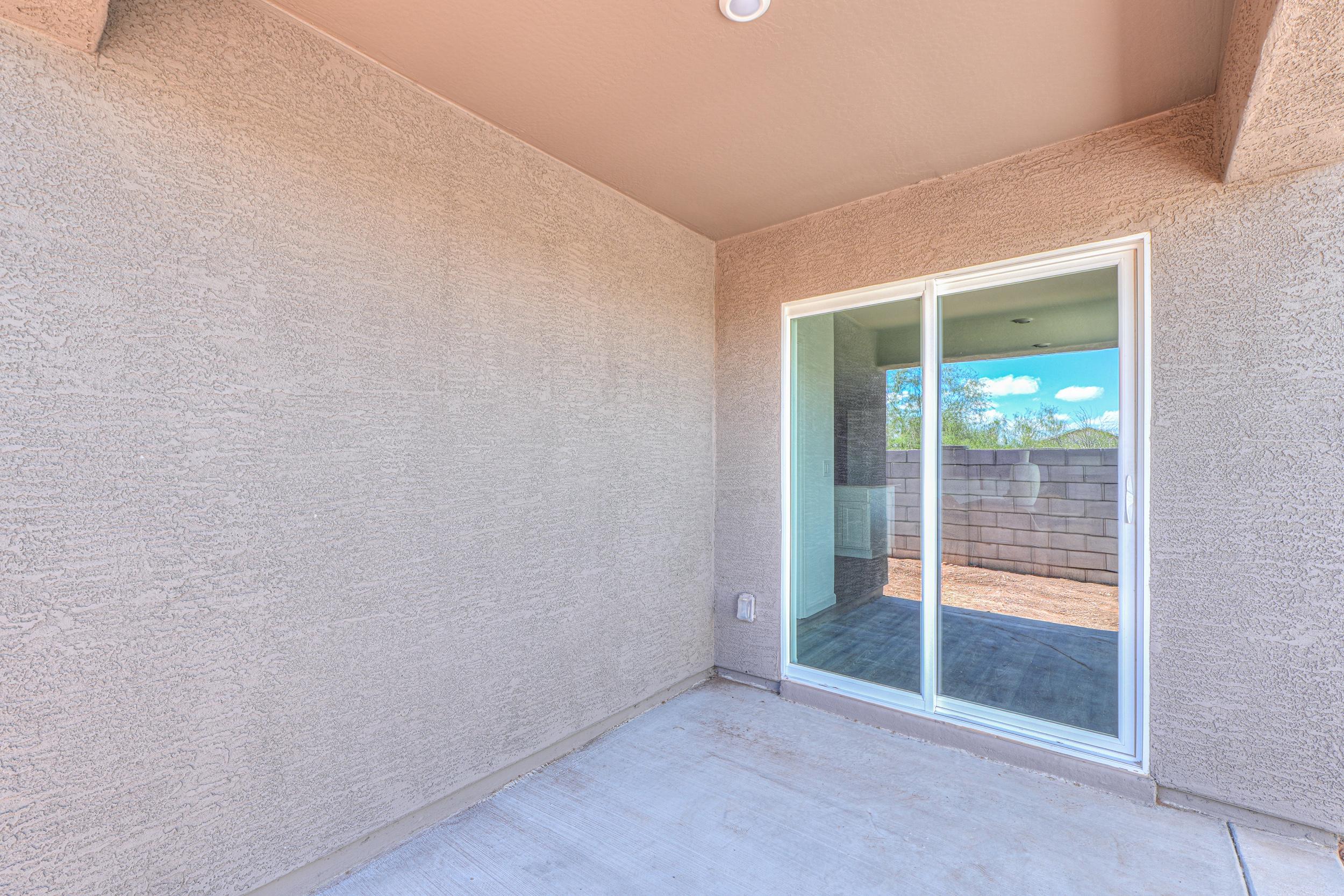 A room with a window and a door.