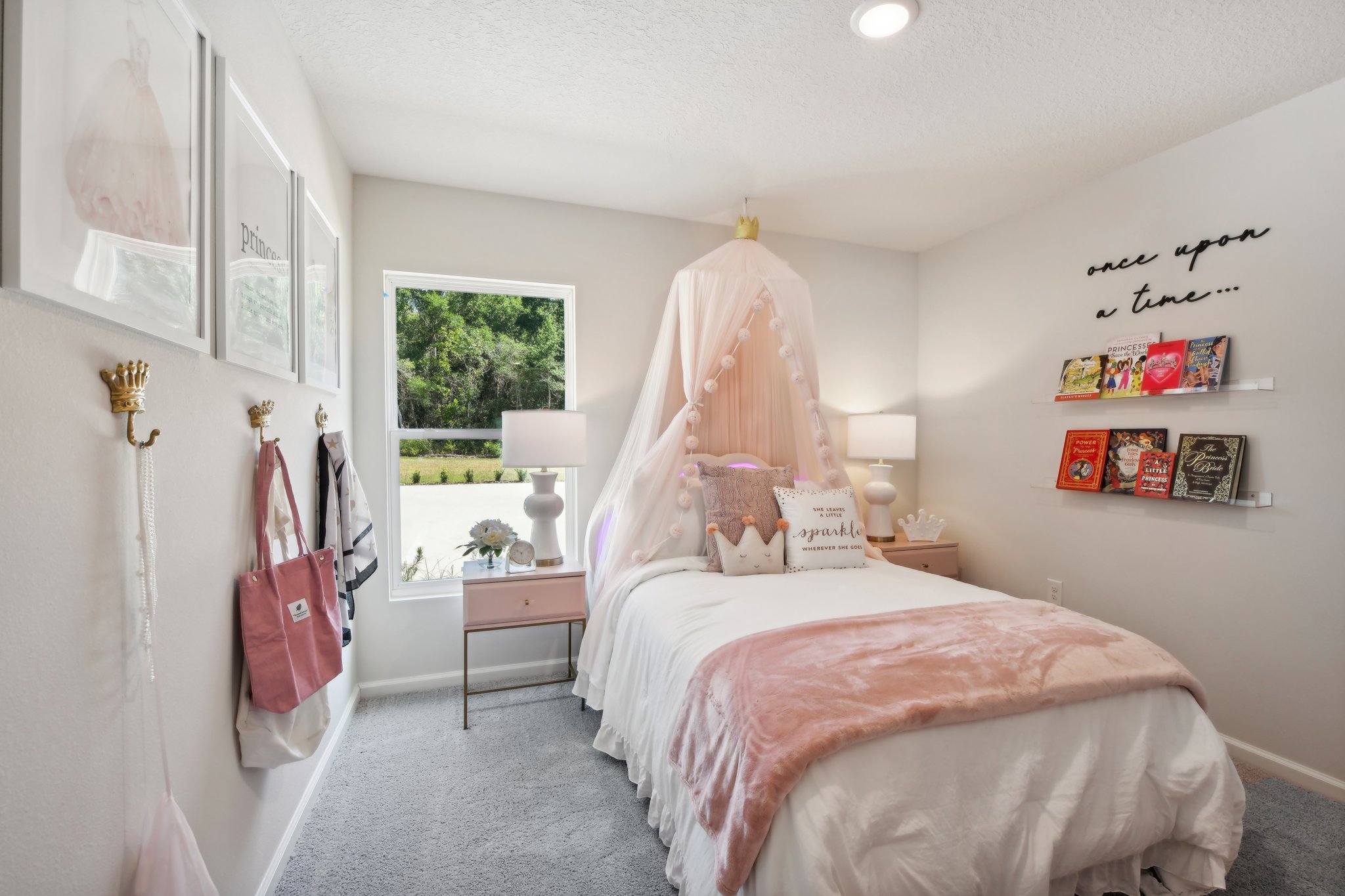 A bedroom with a bed and a window.