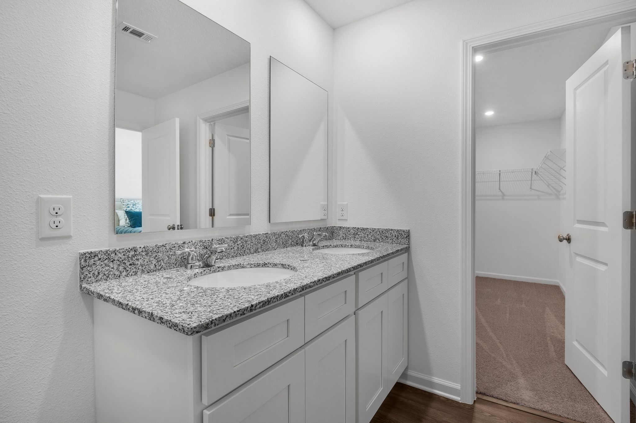 A bathroom with a marble countertop.