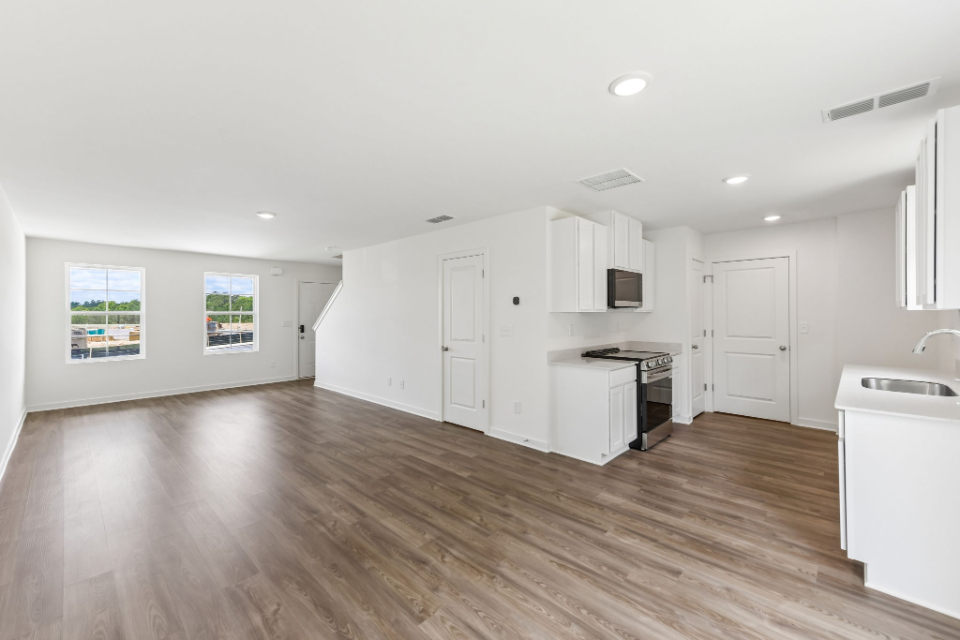 A large kitchen with white cabinets.