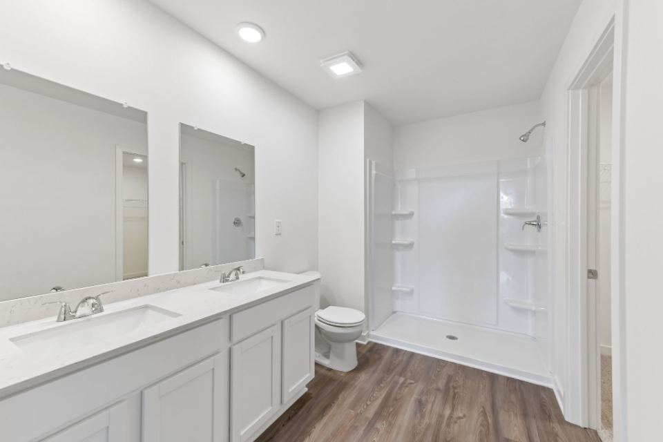A bathroom with a glass shower.