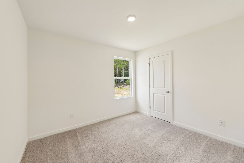 A room with a door and a window.