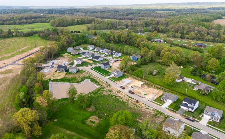 A group of houses in a field.