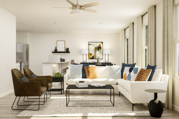 A living room with a white couch and a coffee table.