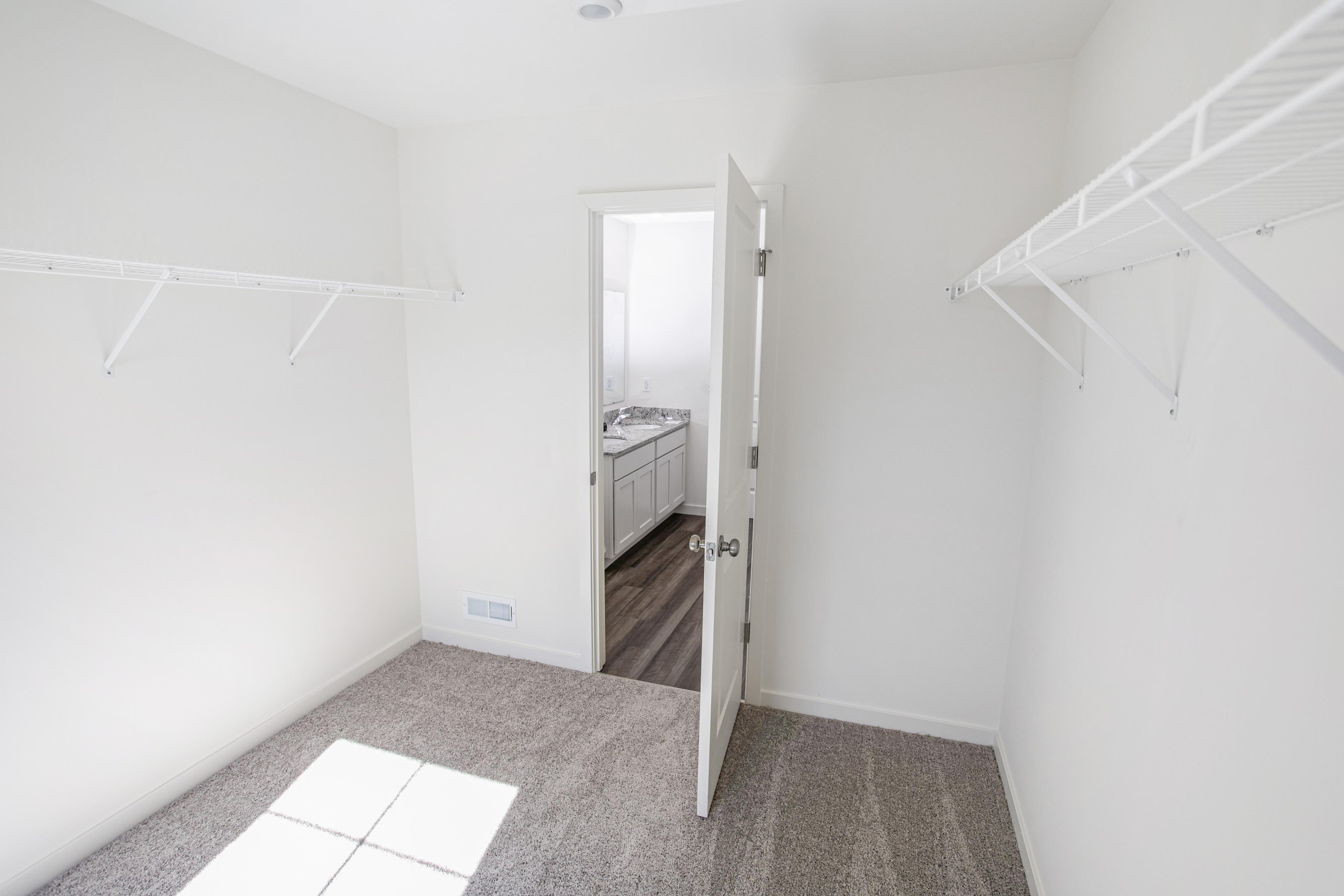 A hallway with a door.