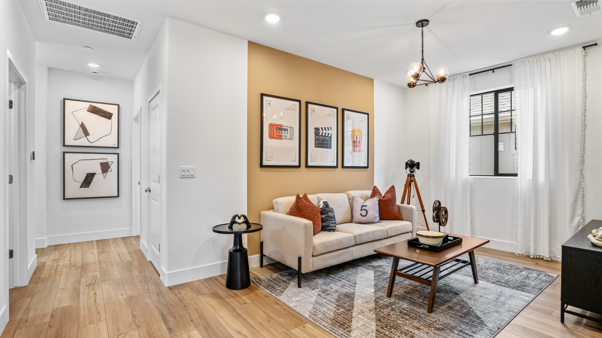 A living room with a couch and a rug.